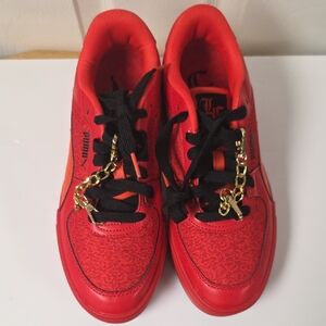 Puma Red Sneakers with Black and Gold Details